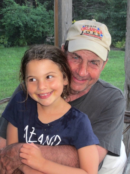 Trillin, known to his friends as Bud, his grown children as Daddy, and his grandchildren as Babbo, snuggles with his granddaughter Rebecca last summer on vacation in Nova Scotia. Photo courtesy of the Trillin family.